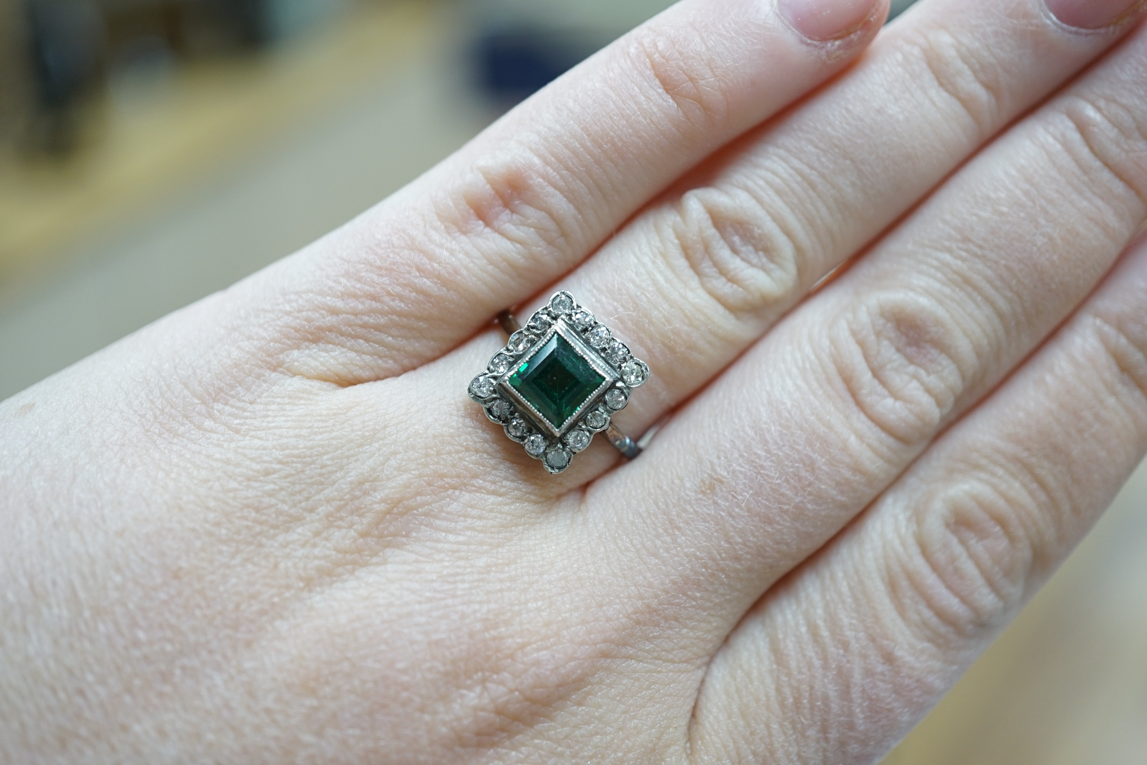 An 18ct gold, green paste? and diamond set square cluster ring, size L, gross weight 2.2 grams.